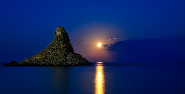 Rock Formation on Sea during Dawn thumbnail