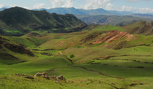 landscape photography of hill at daytime thumbnail