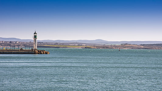 white and gray lighthouse near body of water thumbnail