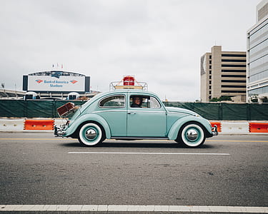 closeup photo of blue Volkswagen Beetle coupe thumbnail
