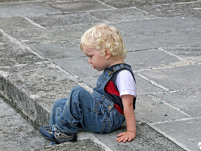 boy wearing blue overalls thumbnail