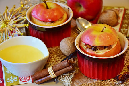 two red apple fruits on red ceramic containers thumbnail