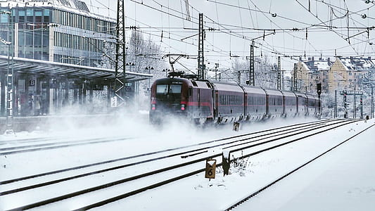 train on railways near building thumbnail