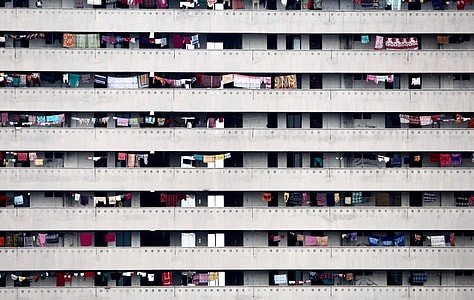 photograph of hanging clothes in a condominium thumbnail