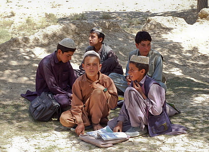 five boys sitting on gray surface during daytime thumbnail