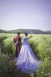 man and woman near grasses thumbnail