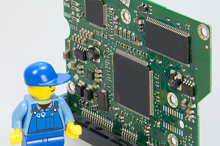 photo of blue LEGO character action figure looking at circuit board thumbnail
