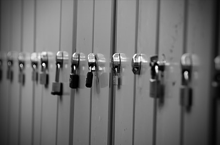 gray metal locker with padlocks thumbnail