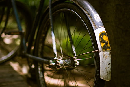 selective focus photography of bicycle wheel thumbnail