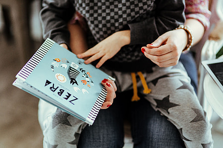 Child reading a book thumbnail