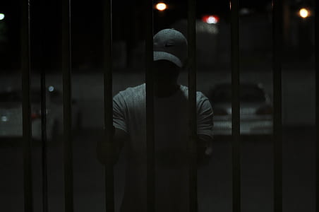 man standing and holding gate thumbnail