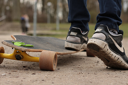 person riding black longboard thumbnail