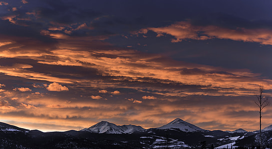 snow covered mountains during sunset thumbnail