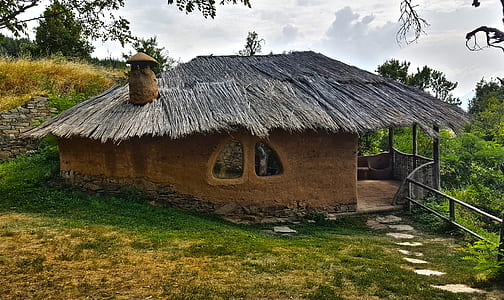 closeup photography of brown nipa hut with chimney thumbnail