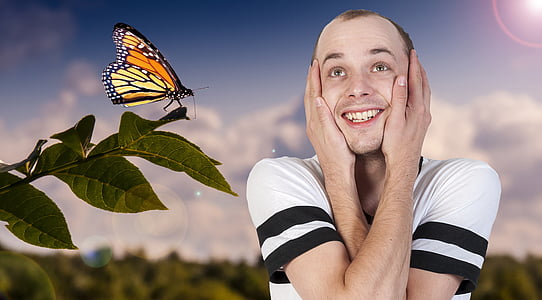 man wearing white and black shirt holding his face thumbnail
