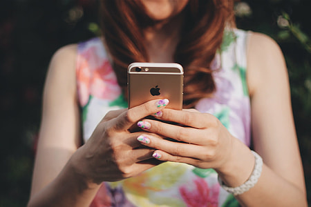 woman holding rose gold iPhone 6 thumbnail