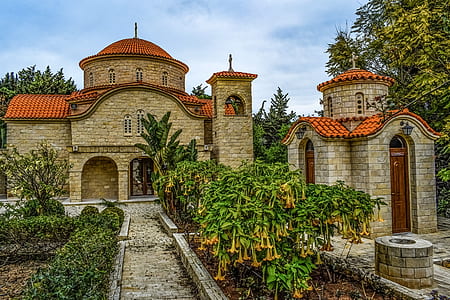 brown and orange castle surrounded with plants thumbnail