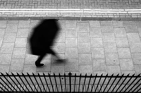 person walking on sidewalk thumbnail