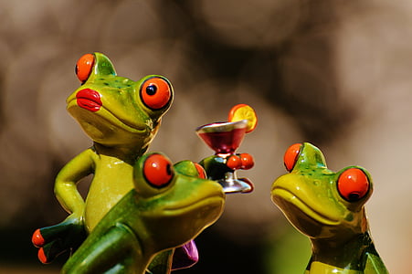 three green frog ceramic figurines in close-up photo thumbnail