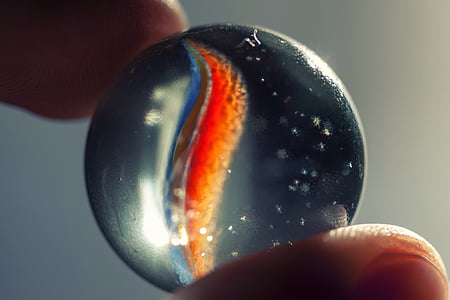 selective focus photography of marble toy thumbnail