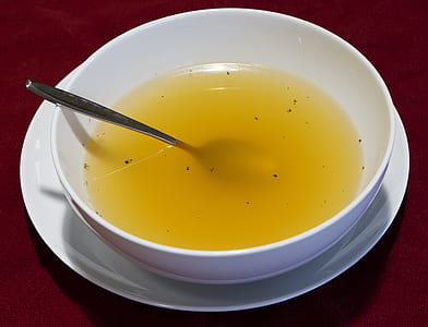 round white bowl filled with yellow liquid thumbnail