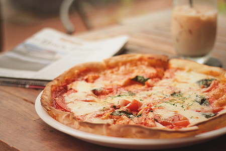 pizza on white ceramic plate thumbnail