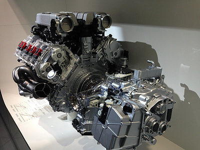 gray vehicle engine on white surface thumbnail