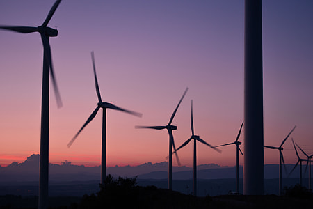 silhouette photo of wind turbines thumbnail