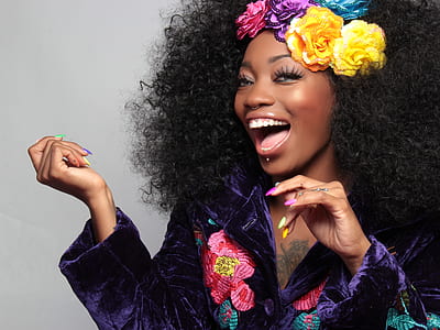 woman in purple satin floral shirt thumbnail