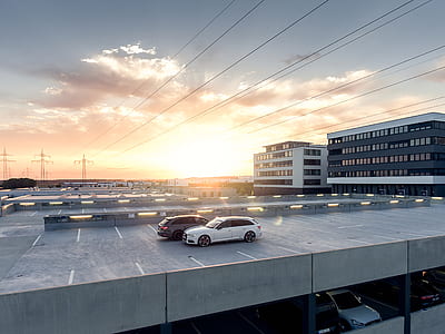white and gray cars on car park thumbnail
