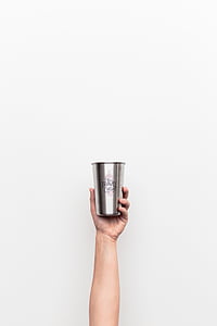 person holding gray Travel stainless steel drinking cup thumbnail