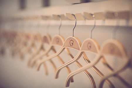 selective photo of wooden cloth hanger thumbnail