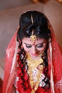 Woman Wearing Red and White Sari thumbnail