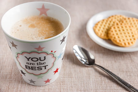 coffee cup near on spoon and saucer thumbnail
