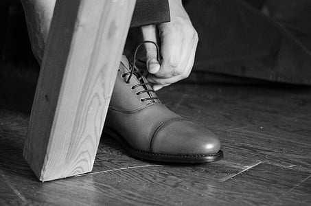 person about to wear leather dress shoe thumbnail