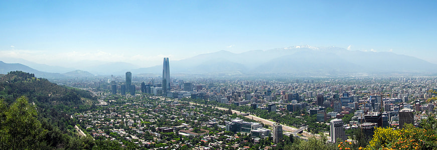 aerial view photography of village near mountain range under calming sky thumbnail
