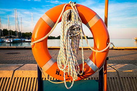 photo of red and gray lifebuoy during daytime thumbnail