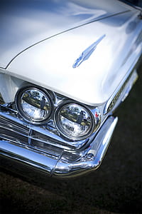 close-up photography of white vehicle thumbnail