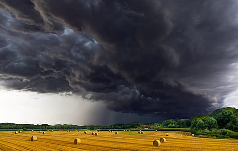 dark clouds under hay rolls thumbnail