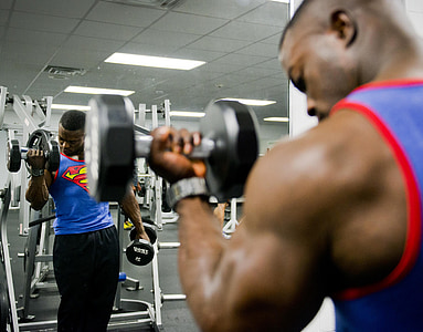 man holding black dumbbell thumbnail