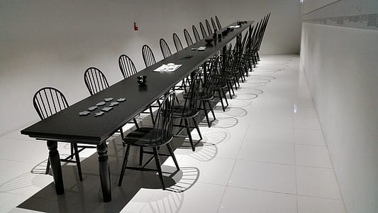 rectangular black dining set on white floor tiles thumbnail