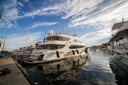 white yacht on dock thumbnail