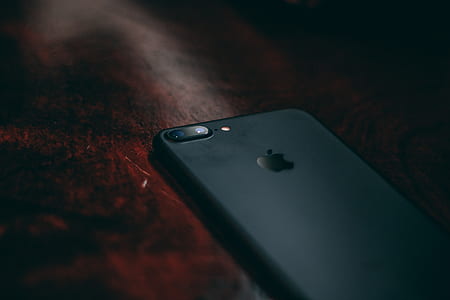 black iPhone 7 plus on brown wooden surface thumbnail