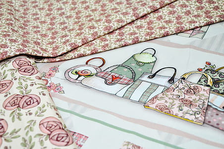 white and red floral textile thumbnail