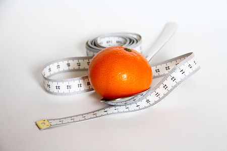tomato beside white tape measure thumbnail