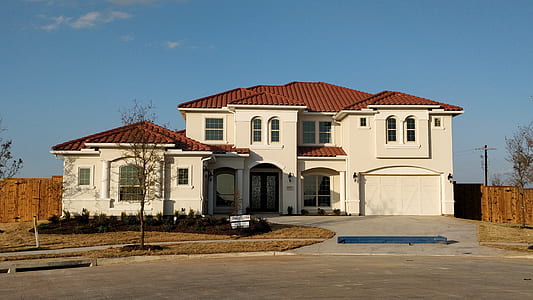 white and red painted house at daytime thumbnail