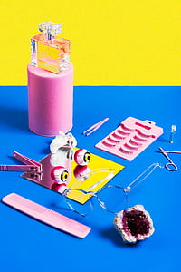 clear framed eyeglasses beside pink hair comb and geode thumbnail