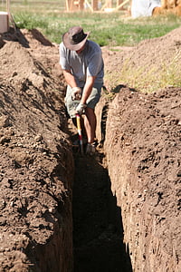 man digging soil thumbnail