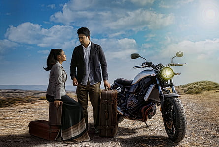 couple standing beside motorcycle thumbnail