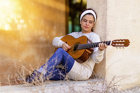 Woman Playing Guitar thumbnail